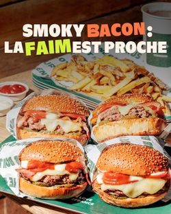 Quatre burgers bio avec fromage, sauces et frites, dans un restaurant kids friendly à Grenoble.