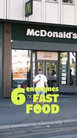 Façade de restaurant McDonald's avec un employé debout devant, symbole de fast food mondialement connu.